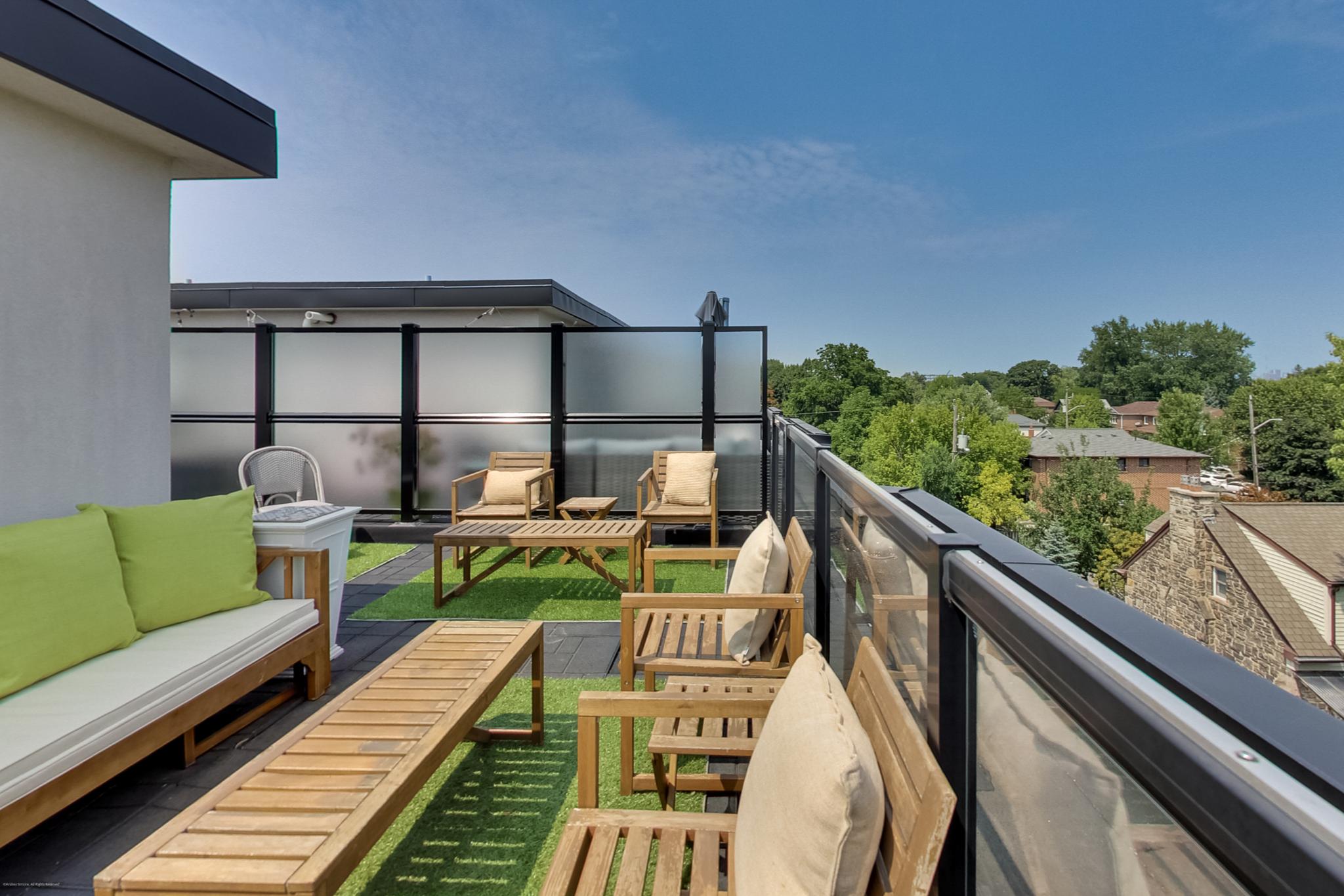 441 Jane St #210 wraparound rooftop deck with two seating areas