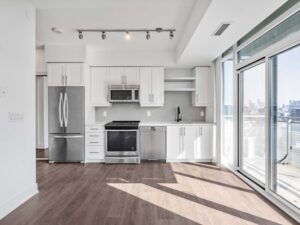 525 Adelaide St W Lph25 kitchen with white cabinets and full sized stainless steel appliances