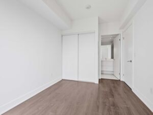 525 Adelaide St W Lph25 primary bedroom with large closet and door leading to the ensuite bathroom