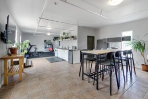 Shared amenity space with a kitchen and workout area.