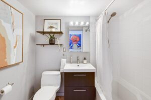 Three-piece bathroom with shower on the left side.